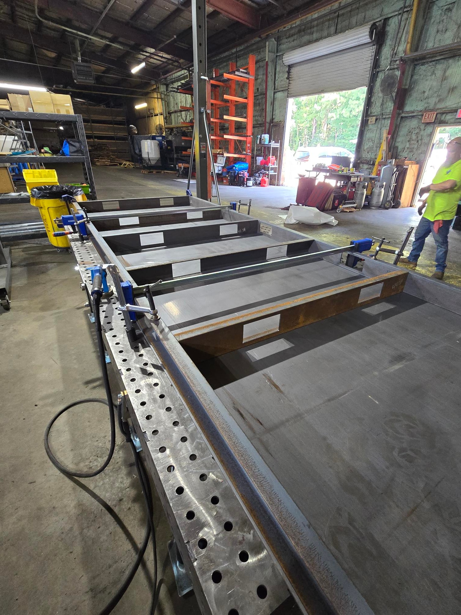 Shop floor view of a large metal fabrication project being assembled